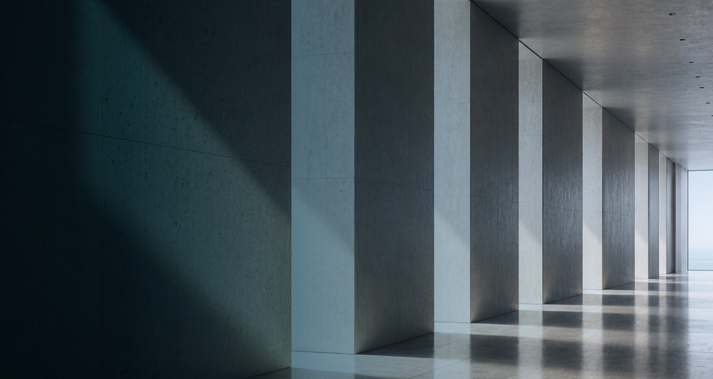 Concrete corridor with columns and natural light