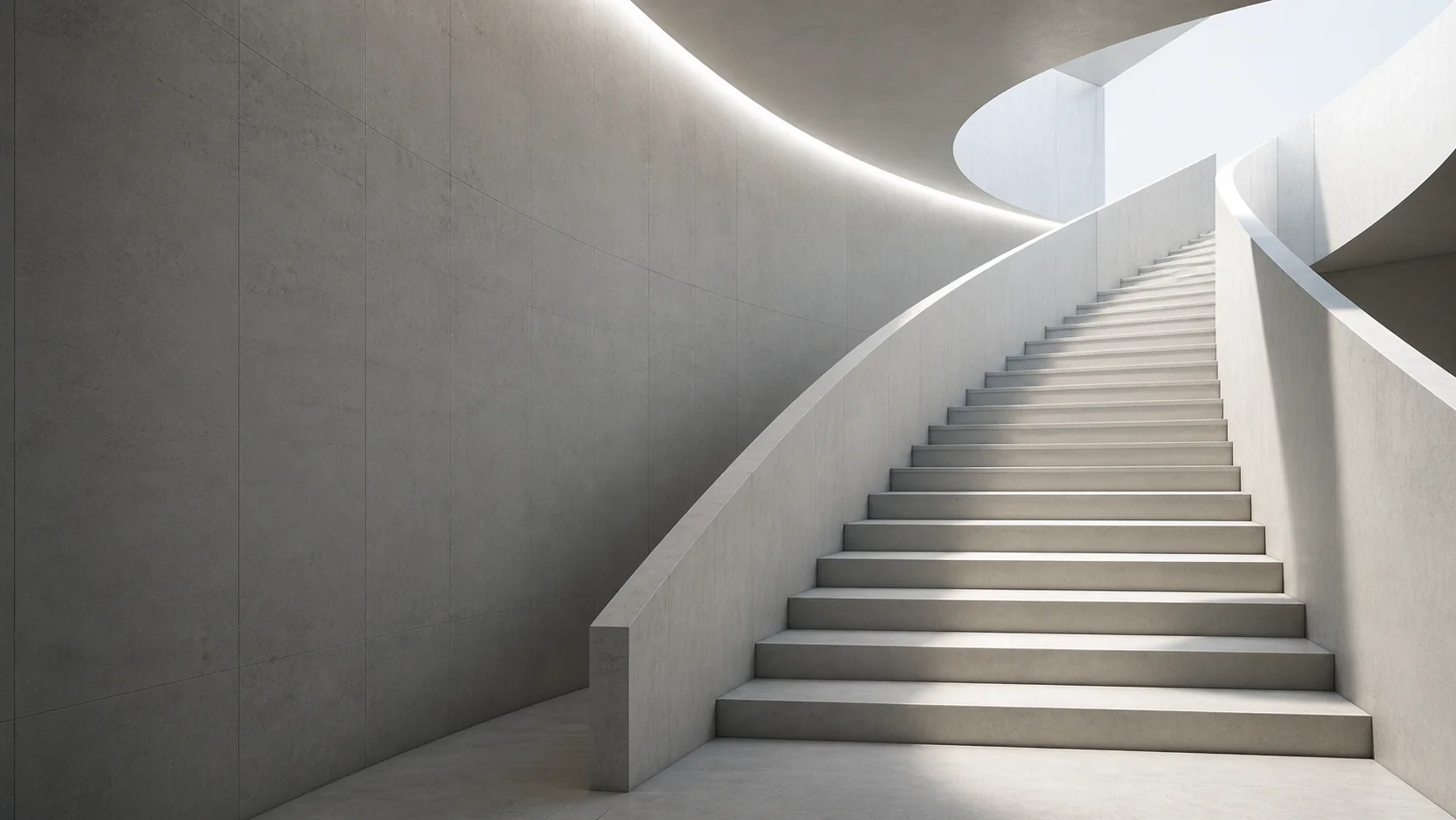 Curved concrete staircase with natural light